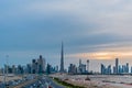 Burj Khalifa and Dubai Skyline under Cloudy Sky, Dubai Downtown Residential and Business Skyscrapers, a view from Dubai Canal