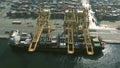 DUBAI, UNITED ARAB EMIRATES - DECEMBER 29, 2019. Aerial view of a docked container ship being loaded and unloaded at