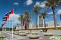 DUBAI, UNITED ARAB EMIRATES - DECEMBER 10, 2016: Dubai street near The Dubai Mall with palm trees and modern high-rise buildings. Royalty Free Stock Photo