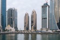 Dubai, United Arab Emirates - December, 2019: Luxury Dubai Marina canal and promenade in beautiful summer day Royalty Free Stock Photo