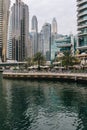 Dubai, United Arab Emirates - December, 2019: Luxury Dubai Marina canal and promenade in beautiful summer day Royalty Free Stock Photo