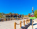 DUBAI, UNITED ARAB EMIRATES - DECEMBER 13, 2018: Wooden signs on the background of the urban pool in the park