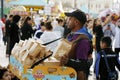Dubai, United Arab Emirates - February 05, 2023 a man selling popcorn in dubai global village
