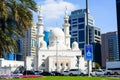 DUBAI, UNITED ARAB EMIRATES - FEBRUARY 1, 2018: Mosque near Dubai Creek surrounded by modern buildings and busy street Royalty Free Stock Photo