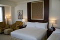 DUBAI, UNITED ARAB EMIRATES - JUN 16, 2019: Bed in a luxury hotel room in the Dubai Finance district