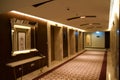 DUBAI, UNITED ARAB EMIRATES - JUN 16, 2019: Long dark corridor in a luxury hotel next to the elevator lobby