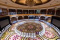 Dubai, United Arab Emirates - large round two-storey event hall inside the famous Burj Al Arab. White chairs form a circle.