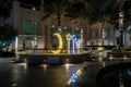 Night view to decorative small square with illuminated Muslim symbols at Dubai Marina in Dubai city, United Arab Emirates Royalty Free Stock Photo