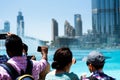 Dubai, United Arab Emirates - March 26, 2018: People gather around the Dubai mall fountain to see the water show