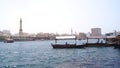 DUBAI, UNITED ARAB EMIRATES - MARCH 31st, 2014: Traditional wooden boats on Dubai Creek as an ferry Royalty Free Stock Photo