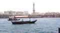 DUBAI, UNITED ARAB EMIRATES - MARCH 31st, 2014: Traditional wooden boats on Dubai Creek as an ferry Royalty Free Stock Photo