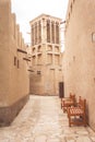 Dubai, United Arab Emirates - March 28th, 2019: View on a traditional wind tower in Al Seef Heritage District. Royalty Free Stock Photo