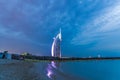 Dubai, United Arab Emirates - 13/04/2019 - Night view of Burj Al Arab, Seven Star Hotel, A view from Jumeirah Beach, Residential a Royalty Free Stock Photo