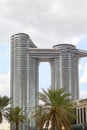 Address Sky View luxury hotel with palm trees, cloudy sky in Dubai