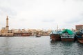 DUBAI, UNITED ARAB Dubai creek, ancient buildings and canal with abra and dhow traditional boats