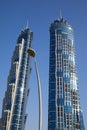 JW Marriott Marquis Dubai, luxury twin skyscrapers in a sunny day, clear blue sky