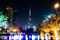Dubai, United Arab Emirates - October 18, 2017: Dubai night scene with tallest building rising behind fountain Royalty Free Stock Photo