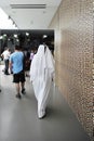 DUBAI, UNITED ARAB EMIRATES, UAE - JUNE 20, 2019: An elegant man with arab dresses walking at the shopping center. Around him