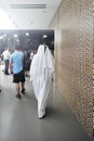 DUBAI, UNITED ARAB EMIRATES, UAE - JUNE 20, 2019: An elegant man with arab dresses walking at the shopping center. Around him