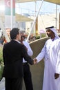 DUBAI, UNITED ARAB EMIRATES, UAE - JUNE 20, 2019: An Arab man and a western man shake hands as a sign of peace. the concept of