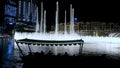 DUBAI, UNITED ARAB EMIRATES, UAE - NOVEMBER 20, 2017: Dancing fountain, beginning of night show, lights flicker on water