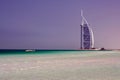 DUBAI, EMIRATES - MARCH 17. 2009: View on Burj Al Arab Tower over white sand and turquoise water