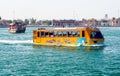 DUBAI, EMIRATES - MARCH 22. 2009: Water amphibian yellow wonder taxi-bus boating in the harbour Royalty Free Stock Photo