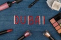 Dubai. World capitals of fashion. Word inlaid rhinestones and cosmetics.