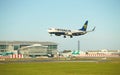 Dubli, Ireland - 10.11.2021: Ryanair airplane on the Dublin airport. Commercial airplane jetliner landing in beautiful sunset ligh Royalty Free Stock Photo