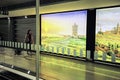 Dublin Airport people, passengers travelling with suitcases on walkway escalator in motion with highlighted images of Ireland in t Royalty Free Stock Photo