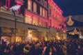 Dublin city, Ireland - 12.11.2021: Scene at Grafton street illuminated and decorated for Christmas. Huge crowd of people enjoy Royalty Free Stock Photo