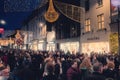 Dublin city, Ireland - 12.11.2021: Scene at Grafton street illuminated and decorated for Christmas. Huge crowd of people enjoy Royalty Free Stock Photo