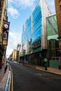 Dublin city, Ireland - 02.10.2021: Small narrow street in old town with modern glass building with reflection of old brick Royalty Free Stock Photo