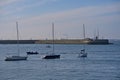 Beautiful evening view of boat yachts on the water at Dun Laoghaire harbors with West Pier lighthouse and Poolbeg chimneys