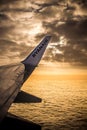 DUBLIN, IRELAND - APRIL 23, 2017: Ryanair logo in the wing of the airplane with sky as the background. Ryanair has cheap flights