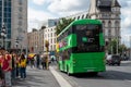 Dublin, Ireland - 07.22.2022: Busy town traffic with double decker busses and cars and international tourists groups