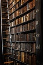 DUBLIN, IRELAND, DECEMBER 21, 2018: The Long Room in the Trinity College Library, home to The Book of Kells. A ladder to reach Royalty Free Stock Photo