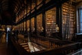 DUBLIN, IRELAND, DECEMBER 21, 2018: The Long Room in the Trinity College Library, home to The Book of Kells. Perspective view of Royalty Free Stock Photo