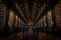 DUBLIN, IRELAND, DECEMBER 21, 2018: The Long Room in the Trinity College Library, home to The Book of Kells. Perspective view of Royalty Free Stock Photo