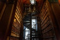 DUBLIN, IRELAND, DECEMBER 21, 2018: Magnificent spiral staircase in The Long Room in the Trinity College Library, home to The Book Royalty Free Stock Photo