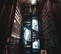 DUBLIN, IRELAND, DECEMBER 21, 2018: Magnificent spiral staircase in The Long Room in the Trinity College Library, home to The Book