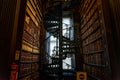 DUBLIN, IRELAND, DECEMBER 21, 2018: Magnificent spiral staircase in The Long Room in the Trinity College Library, home to The Book