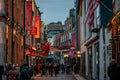 DUBLIN, IRELAND, DECEMBER 24, 2018: People walking in Temple Bar in christmas time. Historic district, a cultural quarter with Royalty Free Stock Photo