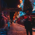 DUBLIN, IRELAND, DECEMBER 24, 2018: People walking in Temple Bar historic district,a cultural quarter with lively nightlife. Royalty Free Stock Photo