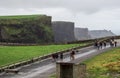 DUBLIN, IRELAND - FEBRUARY 17, 2017: The Cliffs of Moher attractions. People going to see the beautiful cliffs Royalty Free Stock Photo