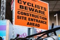 Cyclists Beware - Construction site entrance ahead - on a street sign