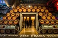 DUBLIN, IRELAND - FEBRUARY 7, 2017: People visiting the interior of the Guinness StoreHouse in Dublin. Wooden barrels of beer