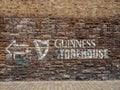 Dublin, Ireland - 07.12.2023: Guinness sign on a wall of a Guinness brewery and museum. Popular travel area and capital landmark