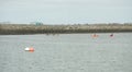 Dublin, Ireland - 03.21.2021: Healthy lifestyle kayaking in the sea. An enthusiast canoeing on a still, calm Irish sea. Recreation