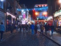 Dublin, Ireland 11.27.2022: Illuminated and decorated Temple bar at night. Popular tourist attraction. Famous pub in the capital